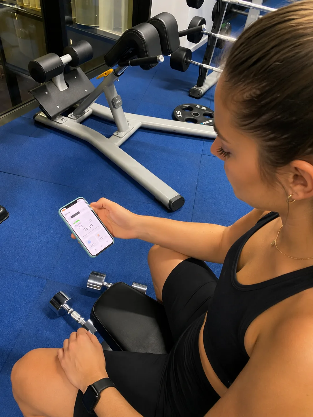 Zing Lab — participant using the Zing Coach app between sets